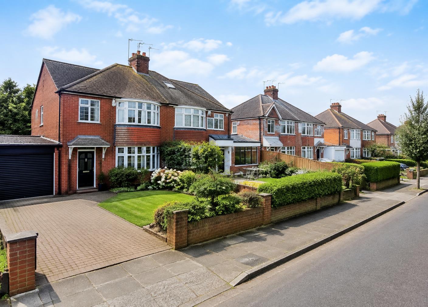 A suburban English neighbourhood with red-brick family homes